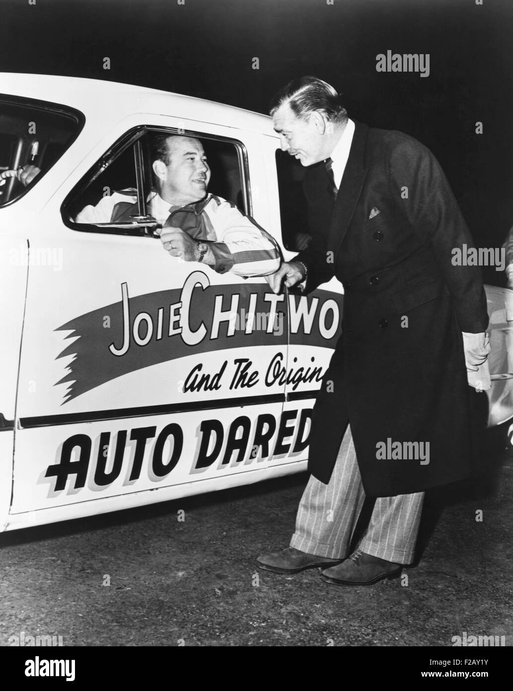 Clark Gable, star of the MGM movie 'TO PLEASE A LADY,' gives Joie Chitwood a wish of good luck. In the film, Gable plays of a driver and stuntman very much like Joie's own life. July 1950. (CSU 2015 9 926) Stock Photo