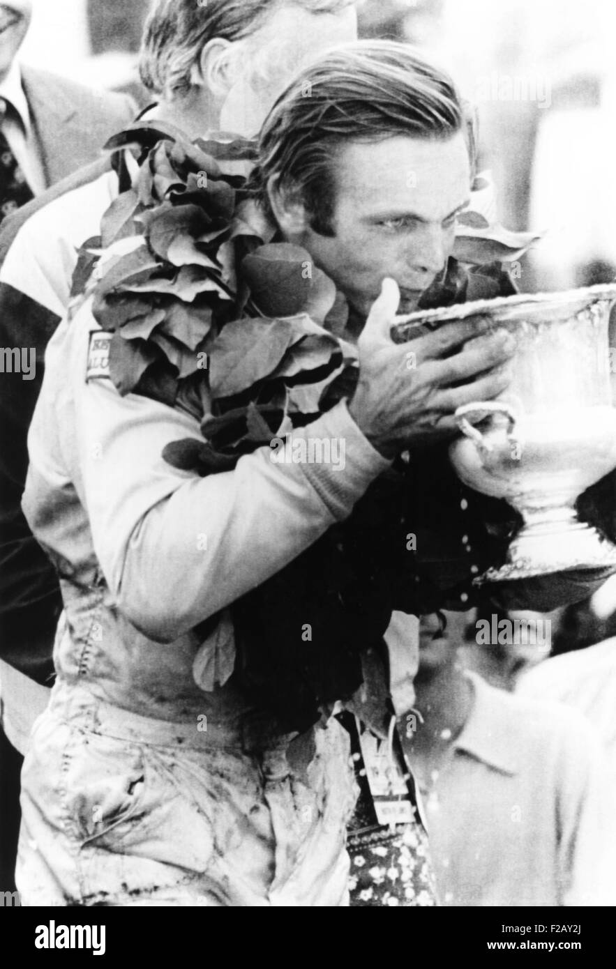 Peter Revson drinks from his trophy after winning the Canadian-American championship. Watkins Glenn, NY, July 25, 1971. He averaged a speed of 128.58 mph. Revson was one of the heirs to the Revlon cosmetics business. (CSU 2015 9 909) Stock Photo