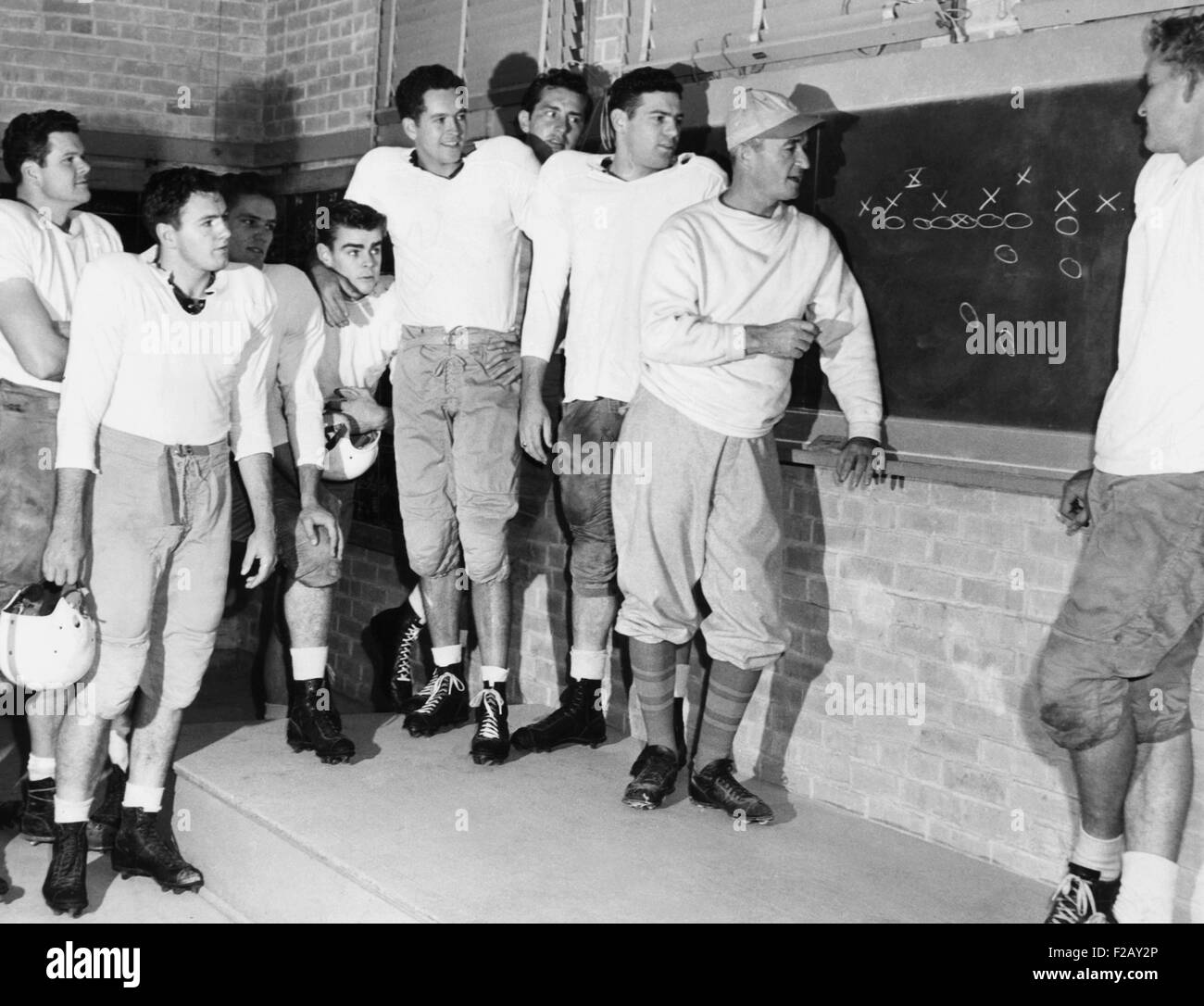 Coach Blair Cherry diagrams plays for the Texas University football team. Dec. 15, 1947. At far right is the stellar back, Bobby Layne. Texas Longhorns beat the Alabama Crimson Tide, 27-7 in the 1948 Sugar Bowl. (CSU 2015 9 905) Stock Photo