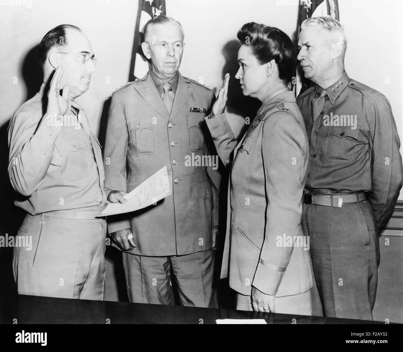 Oveta Culp Hobby sworn in as a Colonel in the U.S. Army. July 5, 1943. She was the commanding officer of the newly created Women's Army Corps, formerly called the Women's Army Auxiliary Corps. L-R: Brig. Gen. H.B.Lewis; George Marshall, Army Chief of Staff; Colonel Hobby; Brehon Somervell, Commander, Army Service Forces. (CSU 2015 9 898) Stock Photo