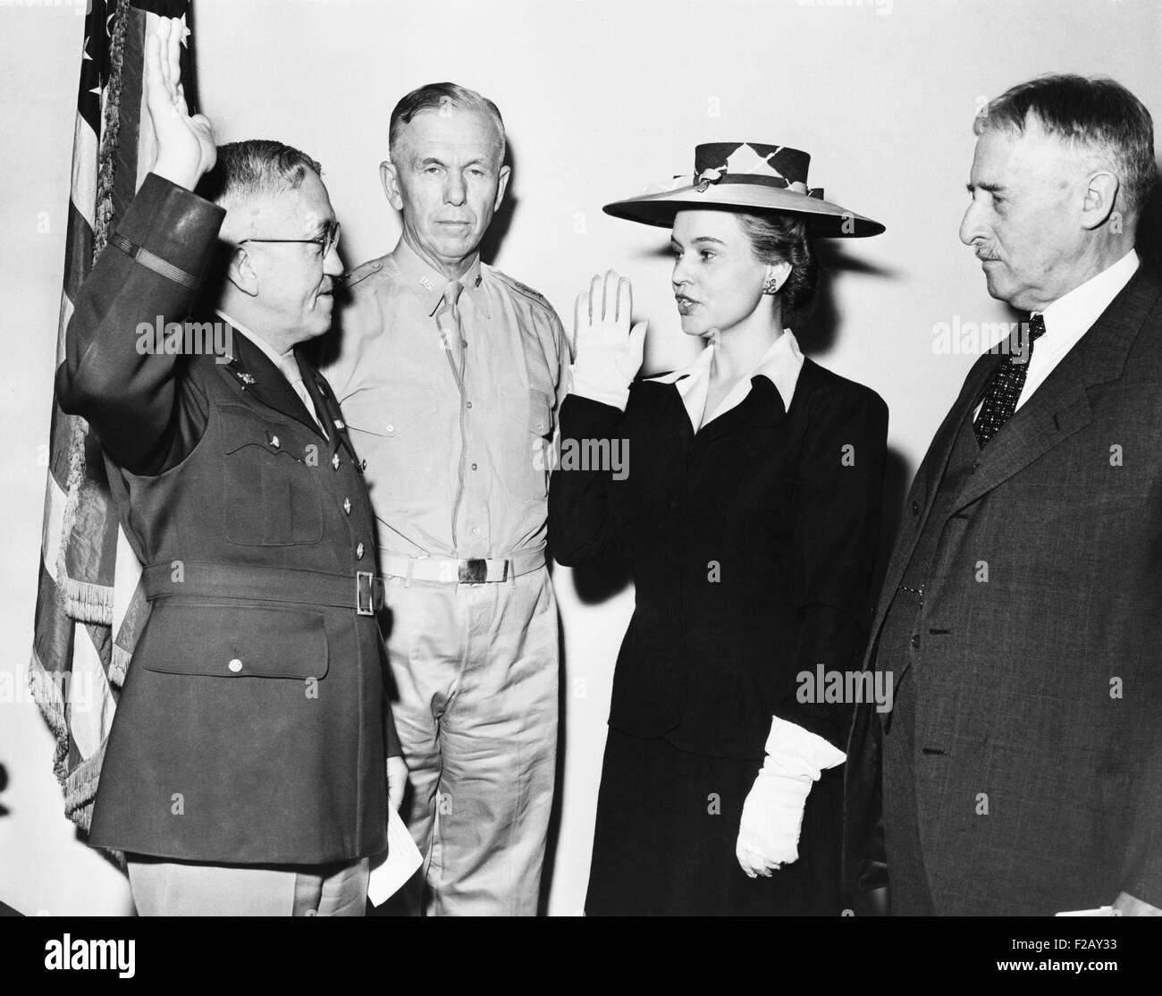 Oveta Culp Hobby, Director of Women's Auxiliary Army Auxiliary Corps, takes oath. May 16, 1942. L-R: Maj. Gen. Myron C. Kramer; Stock Photo