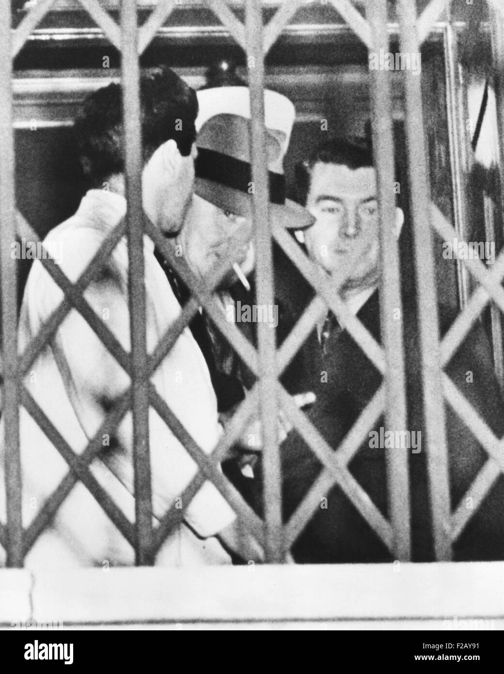 Tammany Boss Jimmy Hines was convicted of protecting the Dutch Schultz mob. Hines smoked a cigarette behind the fence at the General Session Court after his conviction, March 2,1939. The Hines' case was one of New York City Prosecutor Thomas Dewey's biggest victories. (CSU 2015 9 843) Stock Photo