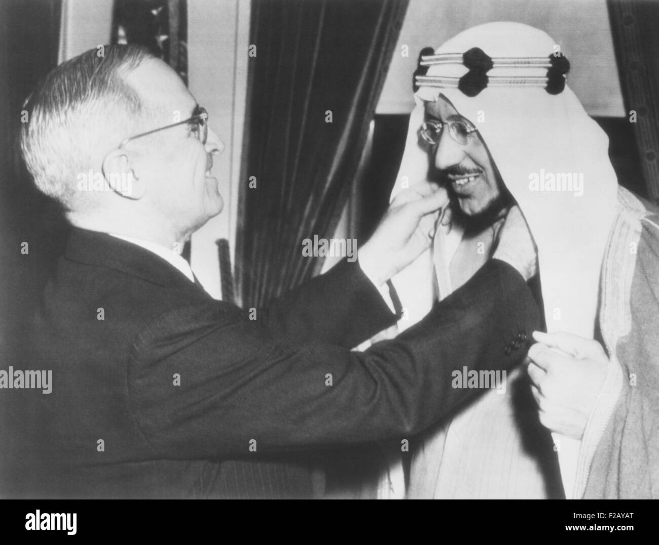 President Harry Truman presents the Legion of Merit to Crown Prince Amir Saud of Saudi Arabia. Feb. 18, 1947. In 1945 President Stock Photo