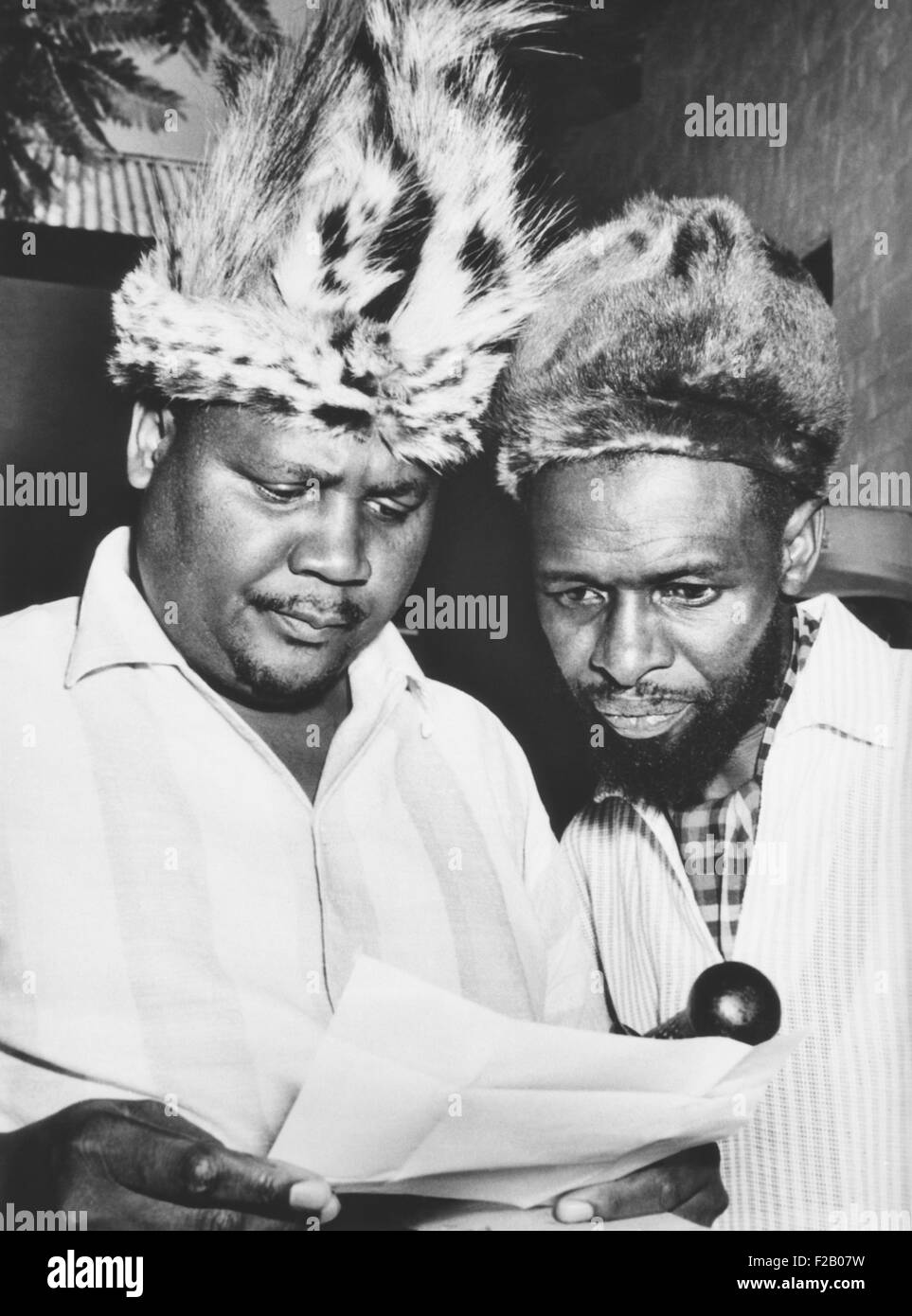 Joshua Nkomo reading a Rhodesian criminal charge against him in April 1963. In 1962 Nkomo founded the Zimbabwe African People's Stock Photo