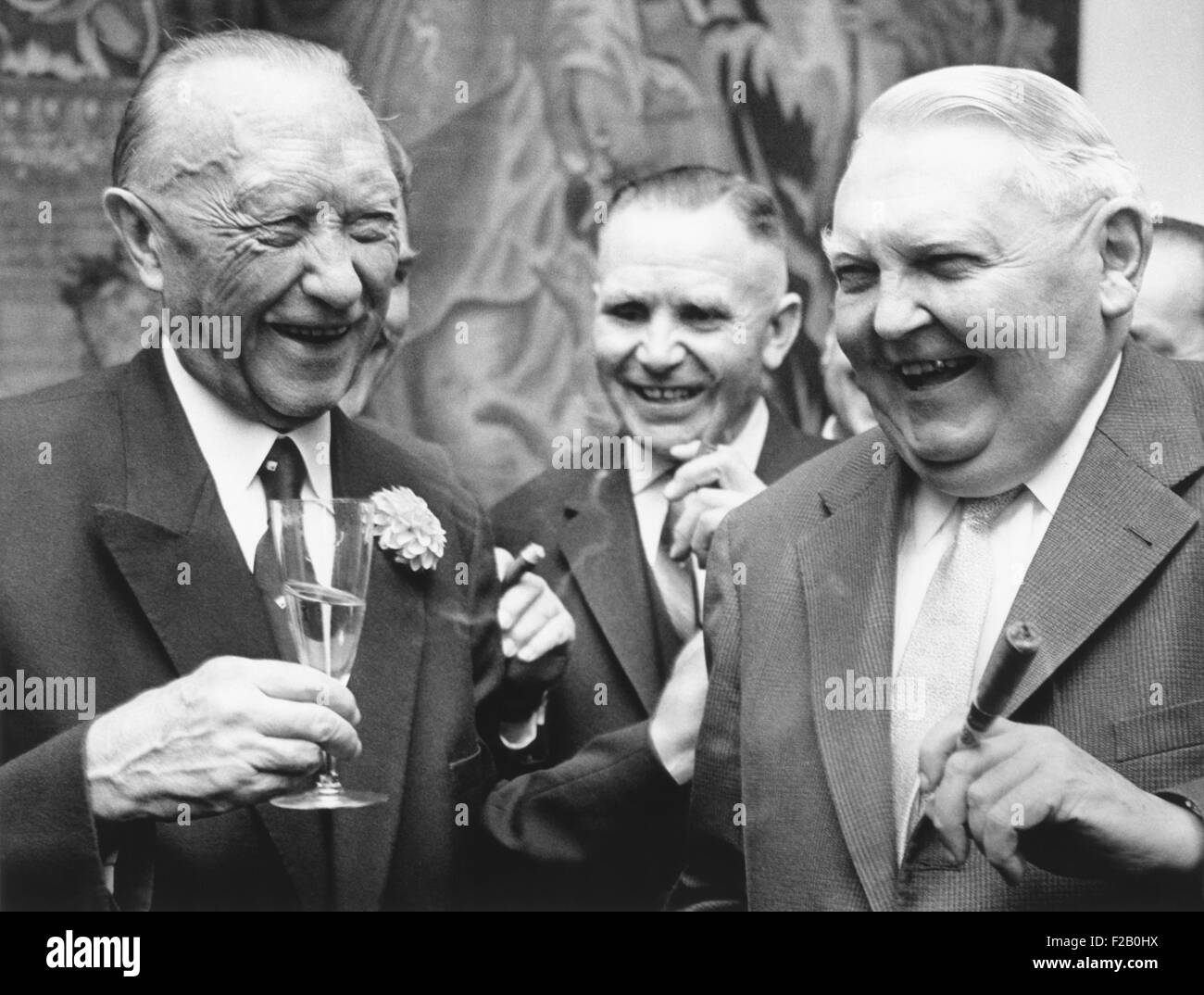 West German Chancellor Konrad Adenauer (left), and Chancellor designate Ludwig Erhard. Sept. 25, 1963. They were attending Adenauer's retirement party at the Chancellery 'Palace Schaumburg' in Bonn, West Germany. (CSU 2015 9 1097) Stock Photo