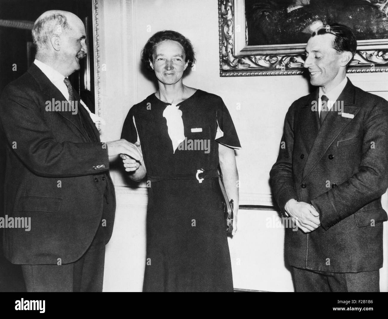 Irene Joliot-Curie with Sir William Brace, head of the Royal Institution, and Frederic Joliot. Oct. 10, 1934. Mme. Joliot-Curie Stock Photo