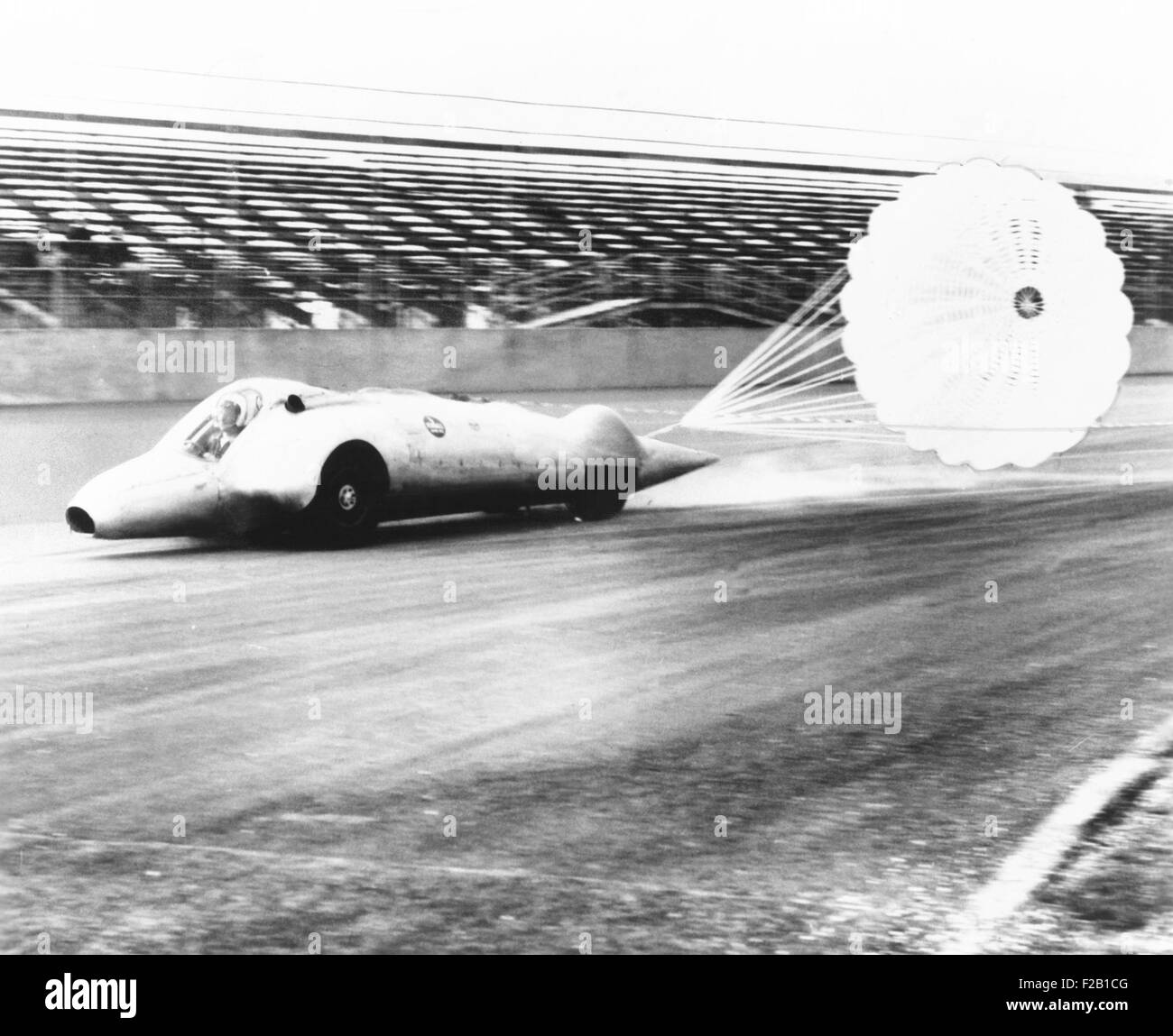 Art Arfons on the Thompson Raceway dragstrip opens twin parachutes to decelerate speed. 1962. (CSU 2015 7 425) Stock Photo