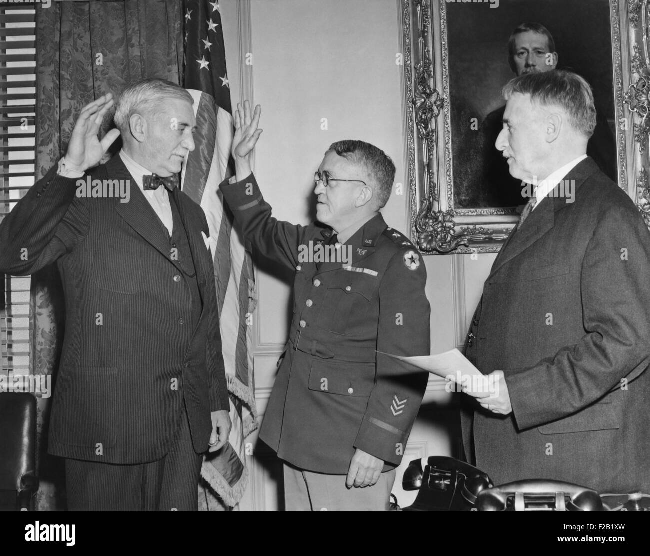 William S. Knudsen is sworn in as Lieut. General by Secretary of War, Henry L. Stimson. Jan. 29, 1942. In 1938-39, his company, Stock Photo