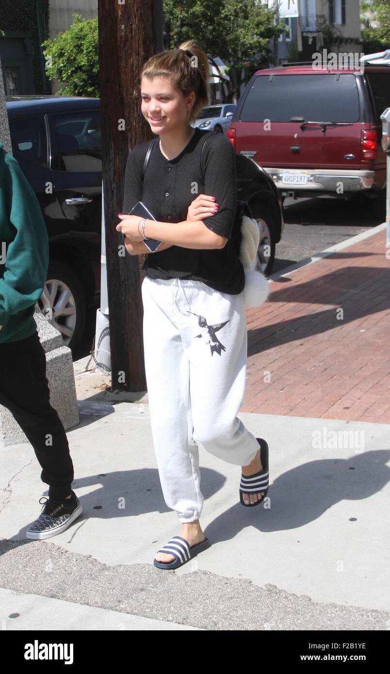 Sofia Richie, wearing FREECITY Sparrow Let's Go Sweatpants and a Chanel  backpack, and her boyfriend go