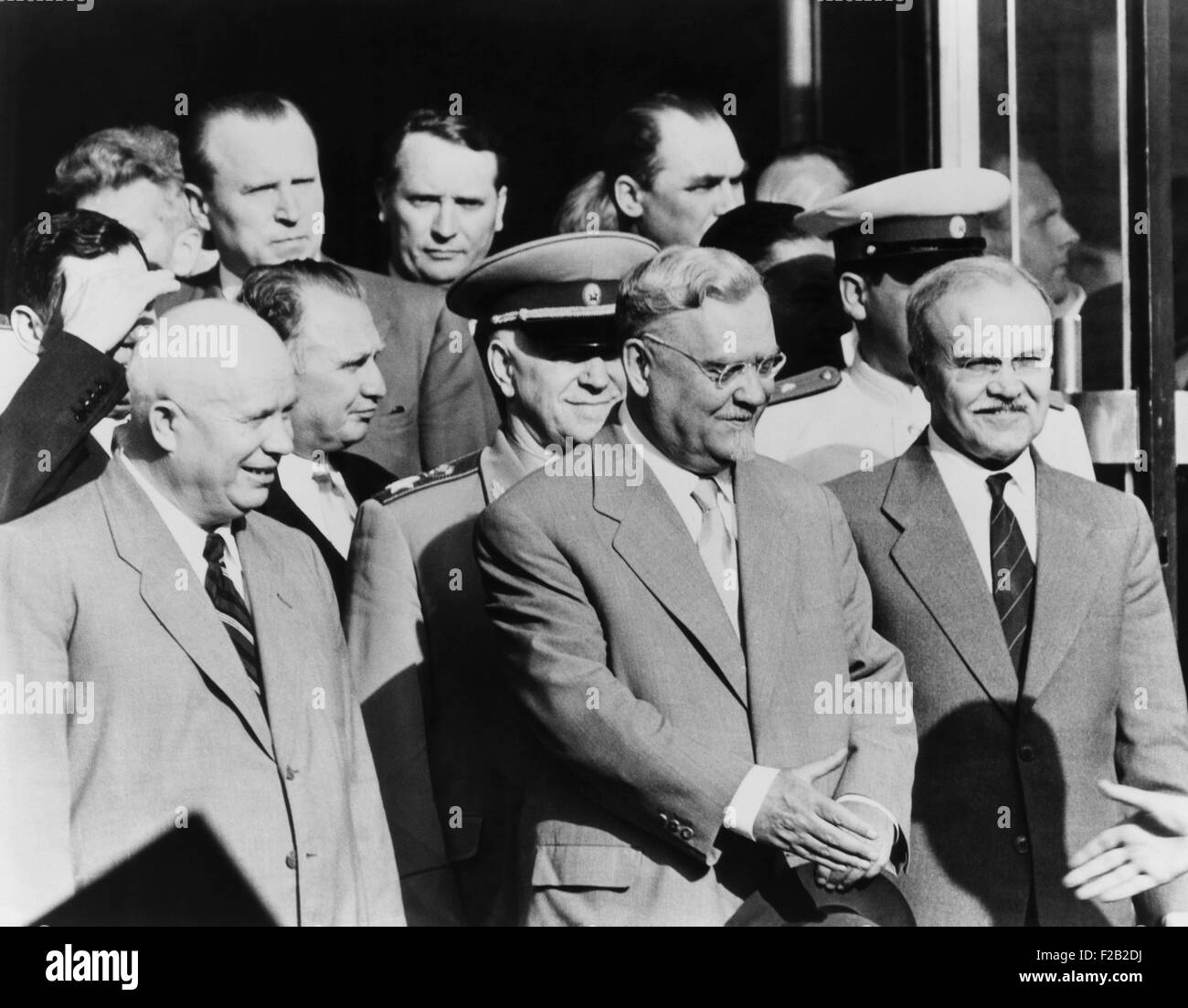 Soviet delegation leaving the Palace of Nations, Geneva, during the 'Big Four' Summit in July 1955. Front row, L-R: Nikita Khrushchev, head of the Communist Party; Nikolai Bulganin, Chairman of the Council of Ministers; and Vyacheslav Molotov, First Deputy chairman of the Council of Ministers of the Soviet Union. 2nd Row, L-R: Andrei Gromyko (shielding face); Yakov Malik; and Marshal Georgy Zhukov, Minister of Defense. (CSU 2015 8 561) Stock Photo