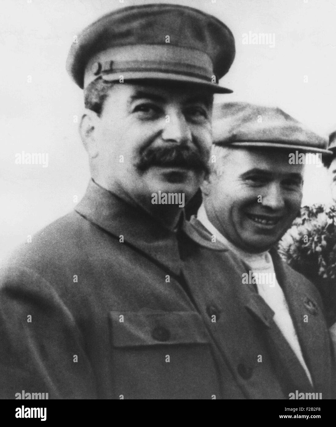 Soviet Russian leader Joseph Stalin in 1938. To right is Nikita Khrushchev, a Member of the Central Committee of the Communist Party and Party Leader in the Ukraine. They are at Shcheilkova Airport near Moscow. (CSU 2015 8 536) Stock Photo