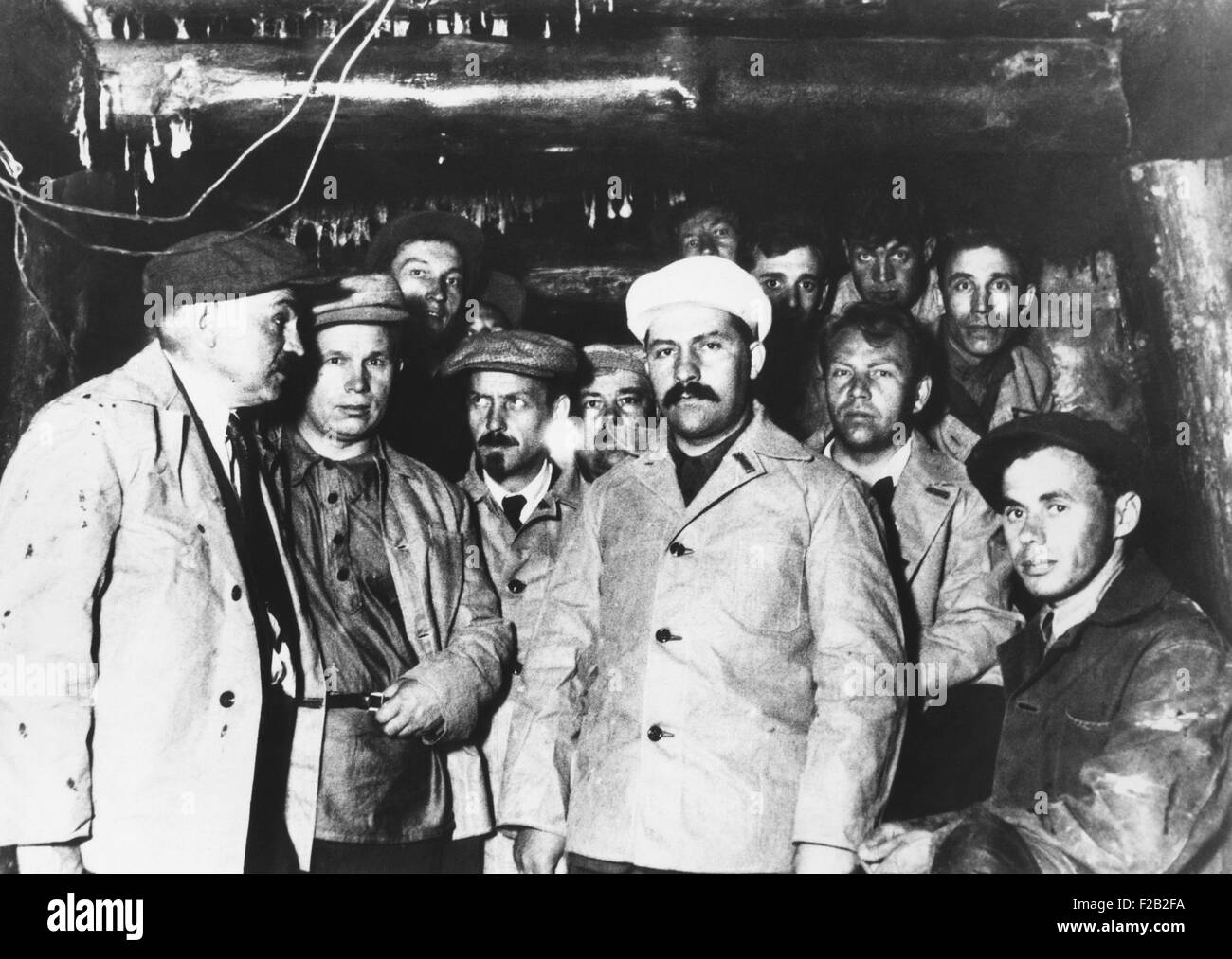 Soviet workers building the Moscow subway are visited by Communist Party leaders. March 26, 1934. In the center in white cap is Stock Photo