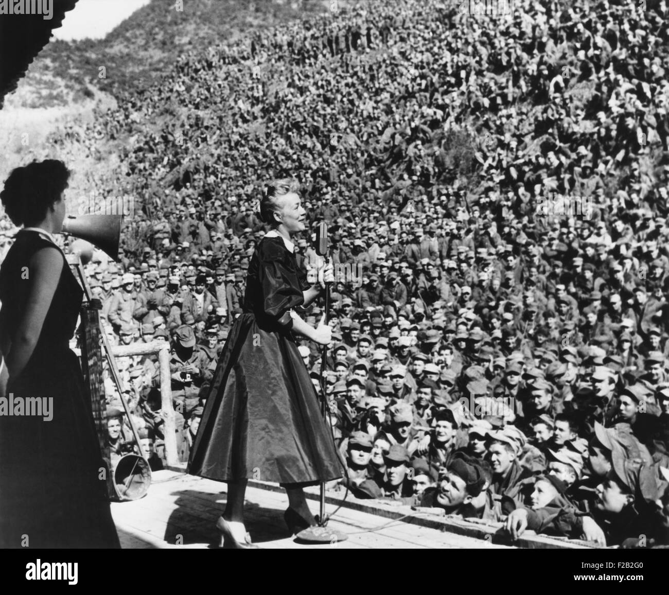 Movie star Betty Hutton entertaining Marines in Korea, March 9, 1952. First Division Marines fill the Montezuma Bowl only a few Stock Photo