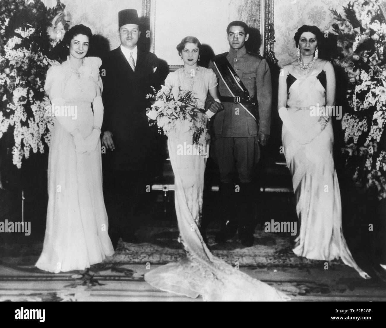 Iran's Crown Prince Reza marries Egyptian Princess Fawzia, March 30, 1939. The wedding group in Cairo's Abdin Palace, L-R: Queen Farida and King Farouk of Egypt; Princess Fawzia and Crown Prince Mohammed Reza; and Queen Mother Nazli. (CSU 2015 8 515) Stock Photo