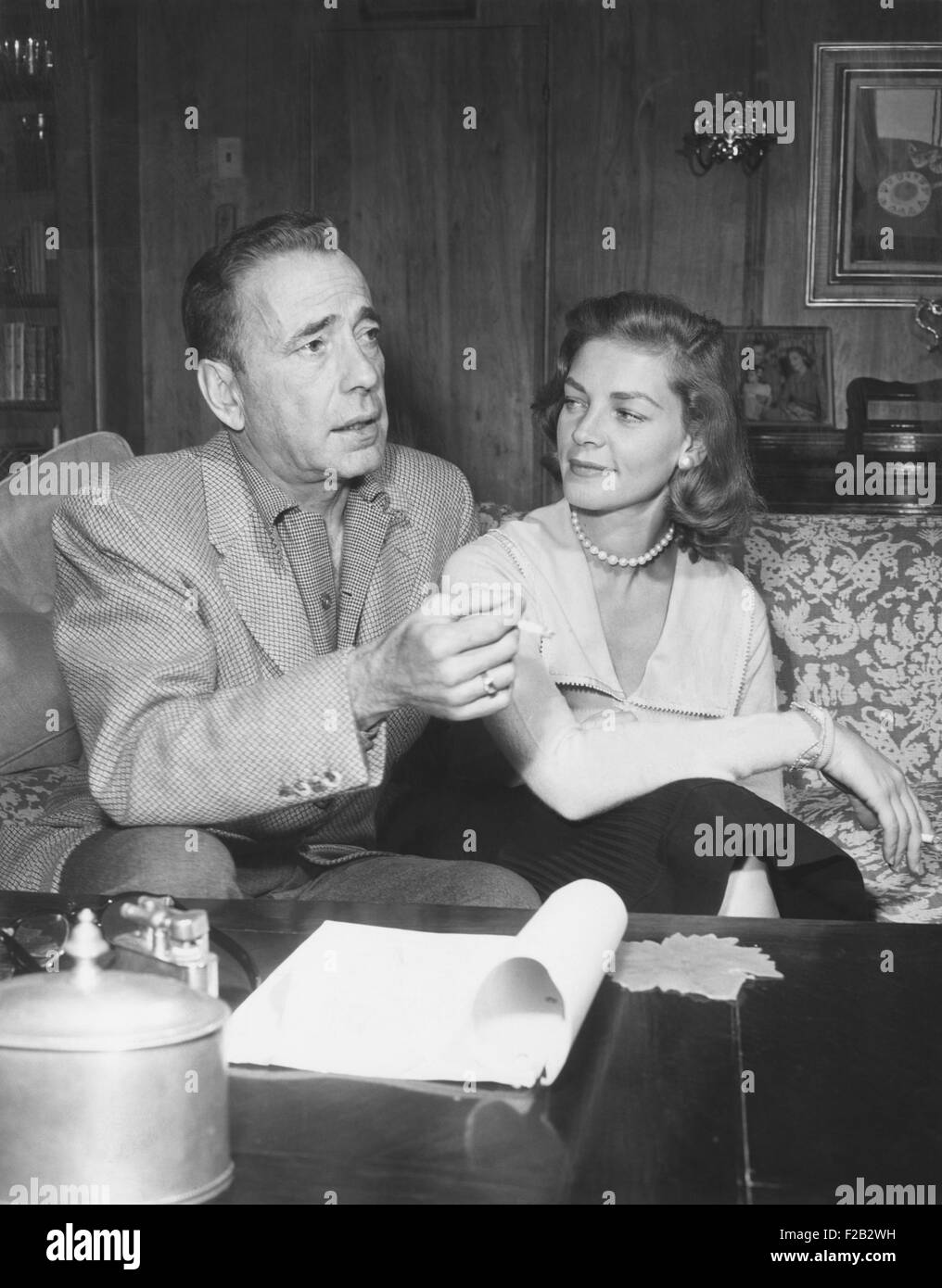 Humphrey Bogart and Lauren Bacall in their living room. May 1955. (CSU 2015 7 321) Stock Photo
