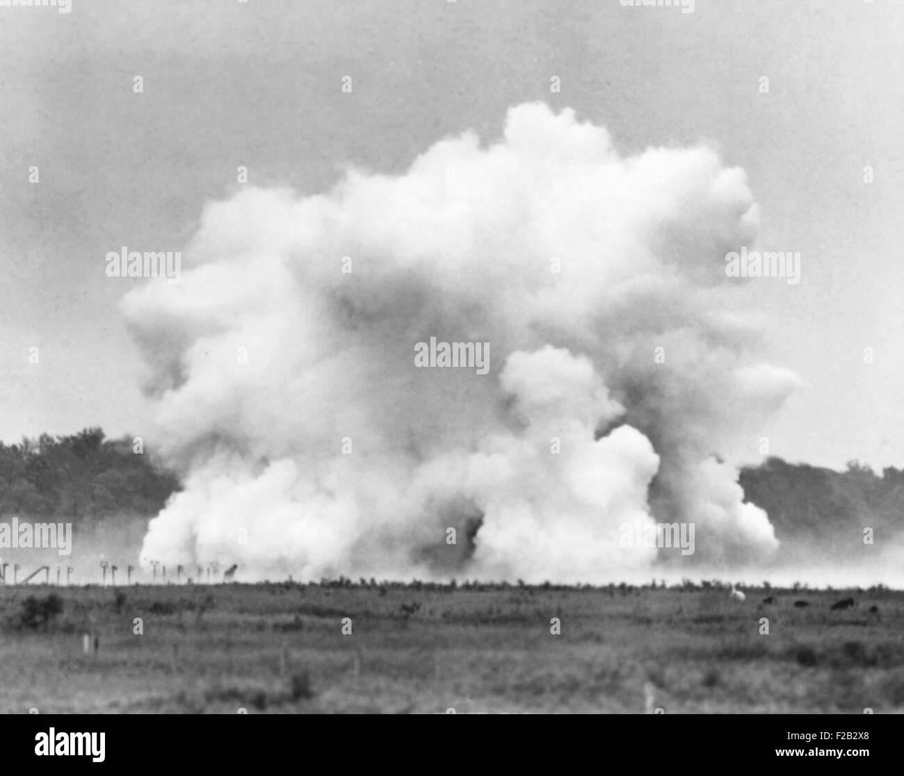 The explosion of Lester P. Barlow's 'GLMITE' bomb at Aberdeen Proving Ground, Maryland. The 1,000 pound liquid oxygen bomb created an powerful roar, but little damage. 84 test goats near the explosion, which Barlow expected to be 'blown to bits', were unharmed. May 25, 1940. (CSU 2015 8 481) Stock Photo