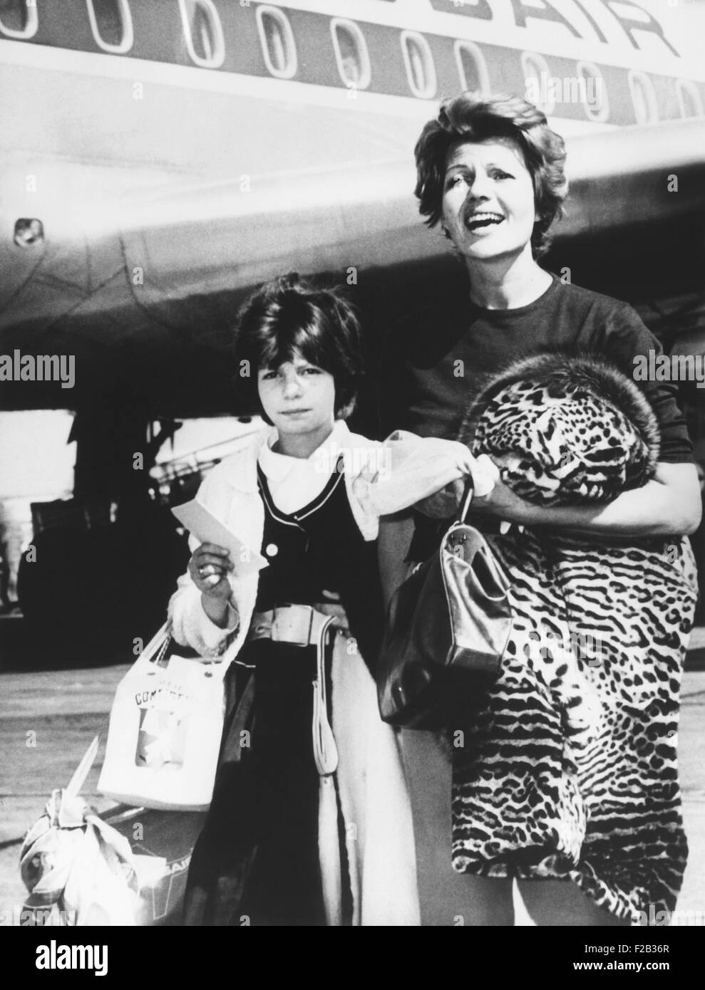 Rita Hayworth and her daughter Princess Yasmin arrive at New York City from Spain. June 3, 1961. In Spain, Hayworth was filming Stock Photo