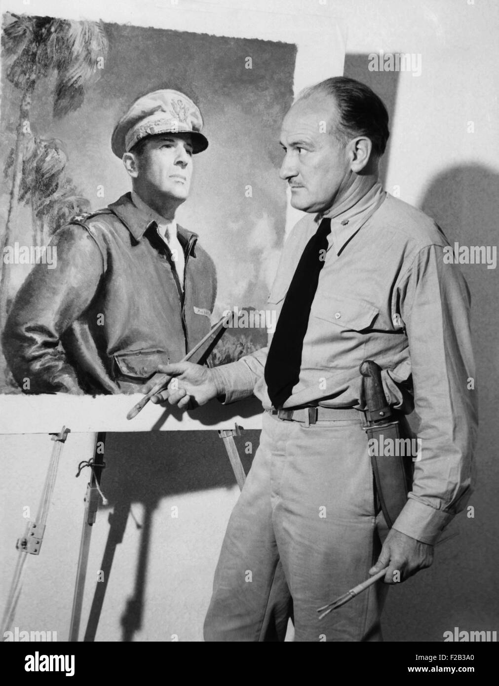 Artist McClelland Barclay with his portrait of General Douglas MacArthur during World War II. In July 1943 he was killed when his ship was torpedoed in the Solomon Islands. He had gone into the combat to sketch the battle action. - (CSU 2015 6 218) Stock Photo