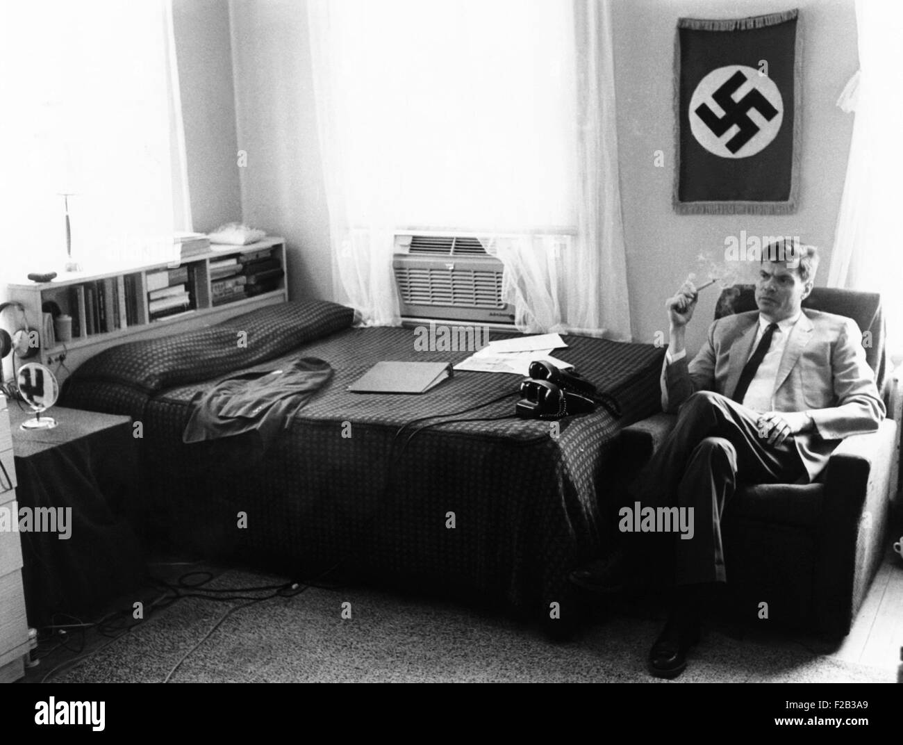 American Nazi George Lincoln Rockwell in the bedroom of his Arlington, Virginia, 'headquarter and barracks'. June 5, 1965. He was intelligent and well educational in philosophy and served in nineteen years in the U.S. Military. In 1960, as a result of his political and racist activities, the U. S. Navy discharged Rockwell one year short of retirement. - (CSU 2015 6 210) Stock Photo