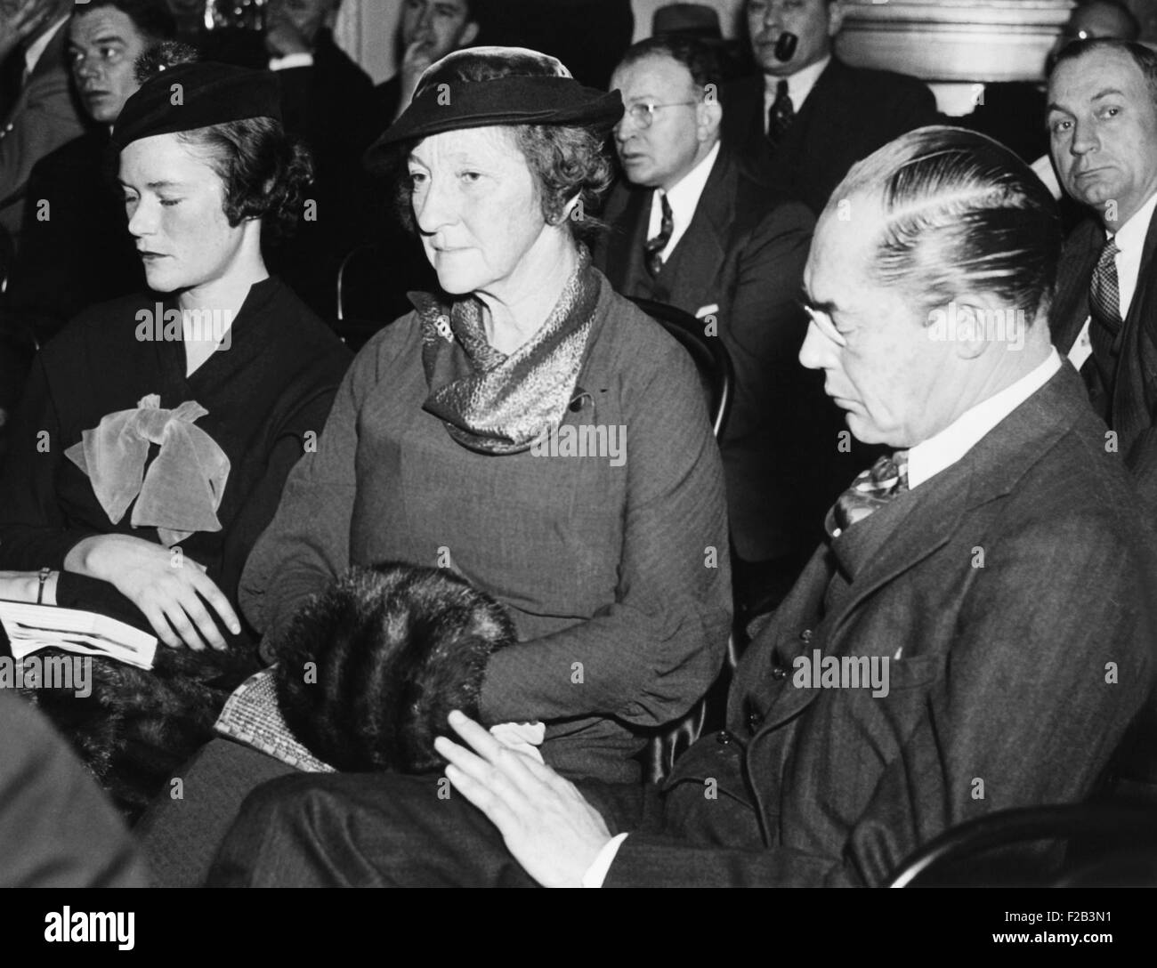 DuPont Ladies at Munitions probe. Right to left: Felix DuPont, Mrs. DuPont and their daughter Lydia, pictured as spectators before the Senate Munitions probe, Dec. 17, 1934. - (CSU 2015 5 50) Stock Photo