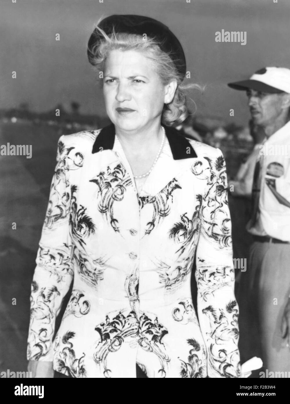 A somber Jacqueline Cochran, owner of the P-51C Mustang, that crashed in the Thompson Trophy Race. Sept 5, 1949. Pilot Bill Odum was killed, as were a young mother and her toddler, when the plane flew into a house in Berea, a suburb of Cleveland. The fatal crash contributed to the air races suspension. - (CSU 2015 5 39) Stock Photo