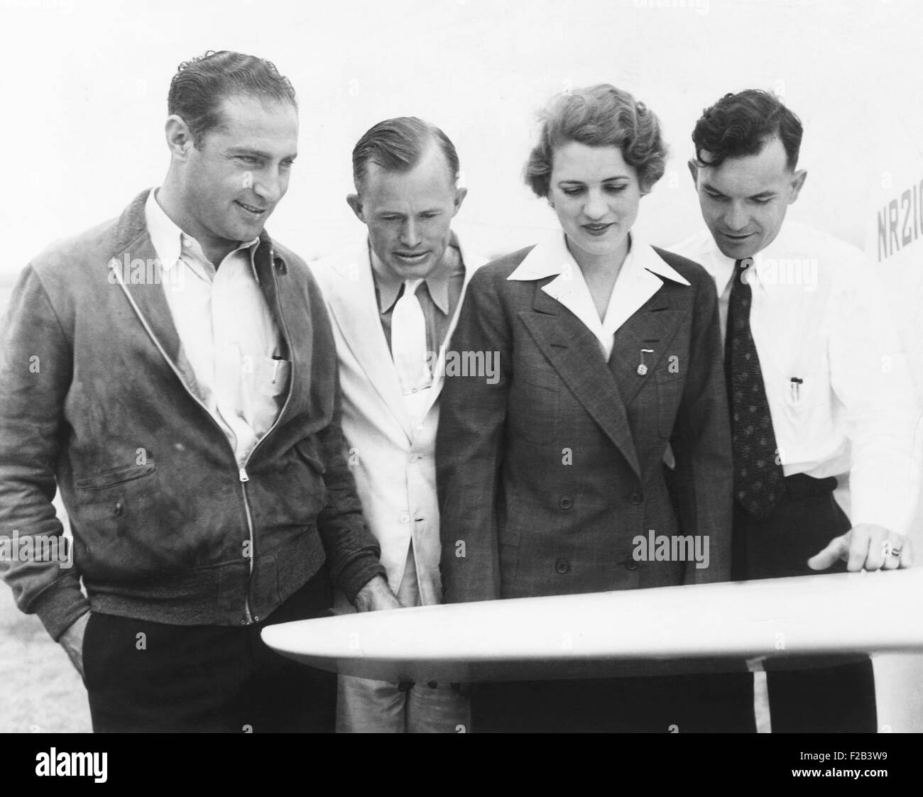 Pilots flying the 1935 Bendix Air Race from Burbank, California, to Cleveland, Ohio. L-R: Cecil Allen, Roy Hunt, Jacqueline Cochran, Royal Leonard. Ca. August 28, 1935. Cecil Allen was killed during the race when his plane crashed in a potato field in the fog. Roy Hunt finished 4th, and Jackie Cochran finished 5th. Royal Leonard was forced down with engine trouble and did not complete the race. - (CSU 2015 5 34) Stock Photo