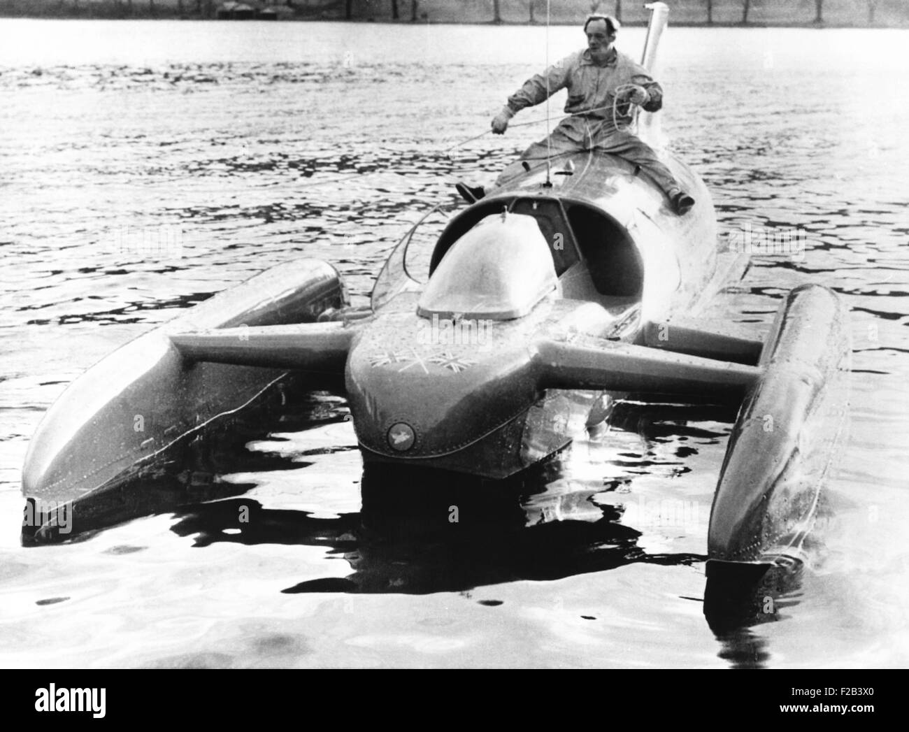 Donald Campbell sits astride his jet powered boat, Bluebird K7, on Lake Coniston. He will attempt to break his two year old water speed record of 276.33 mph. Nov. 22, 1962 - (CSU 2015 5 18) Stock Photo