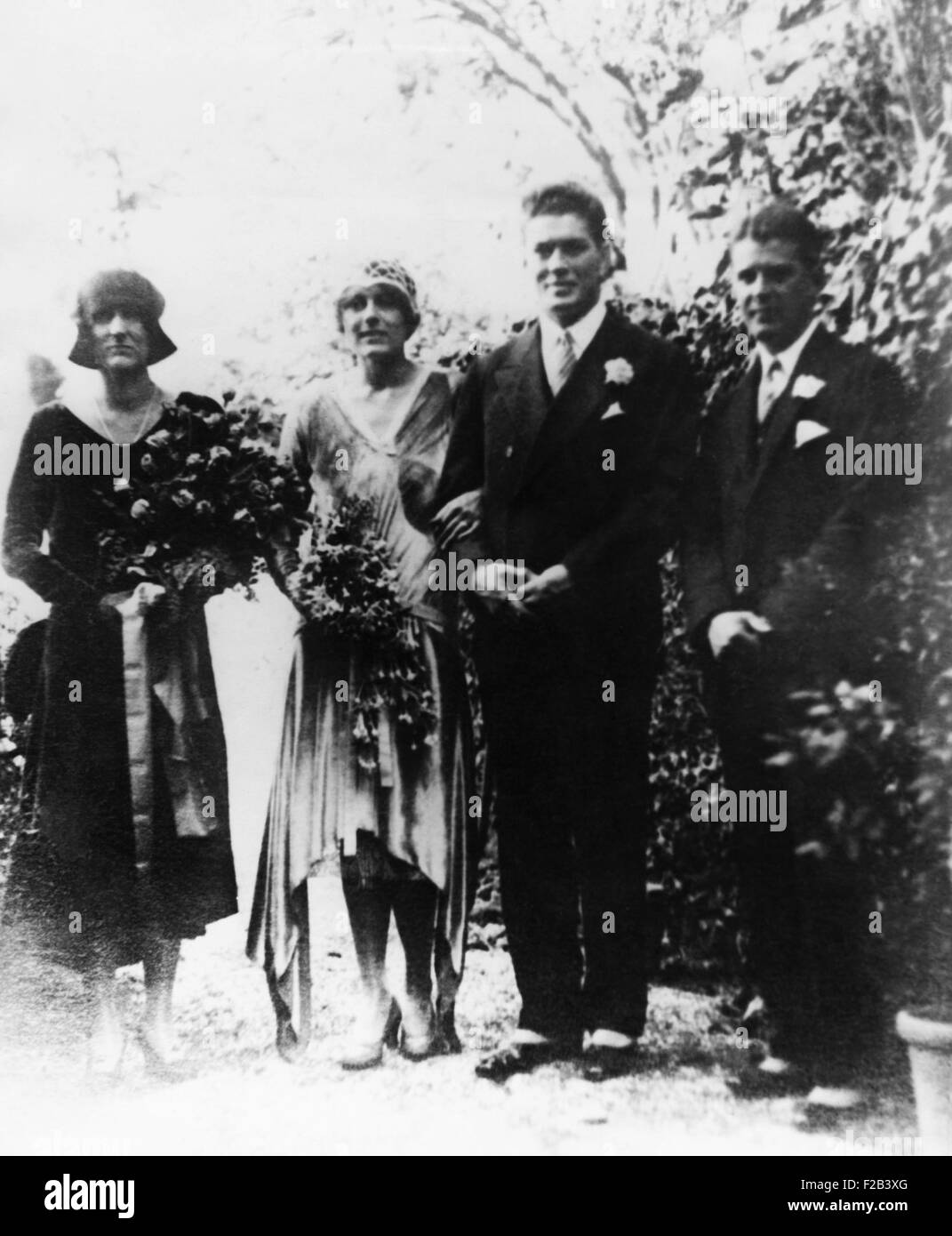 Gene Tunney and wife Polly Lauder Tunney on their wedding day at the Hotel Russie, Rome. Oct. 3, 1928. At right is Dr. Carnos Weekes, the best man. The wedding in Rome caused a press frenzy as photographers jostled to capture images of the couple. - (CSU 2015 5 159) Stock Photo