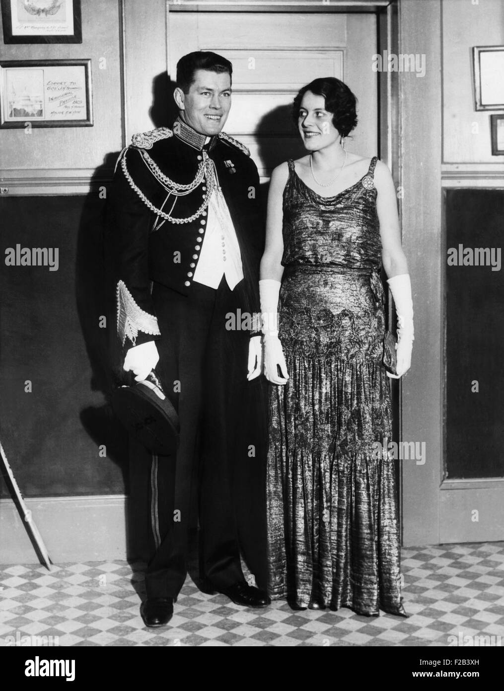 Gene Tunney and wife Polly Lauder Tunney in formal attire. He is wearing a dress uniform of the Marine Corps. Tunney served in the Marine Corps branch of the Connecticut State Militia. The couple married on Oct. 3, 1928, on the condition that Tunney retire from professional boxing. - (CSU 2015 5 158) Stock Photo