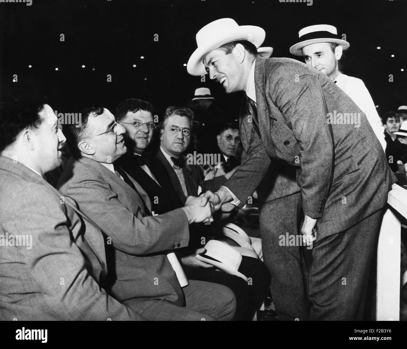 Two prominent citizens were at the ringside in the Cleveland Stadium. Gene Tunney, the retired undefeated heavyweight champion and Mayor Anton J. Cermak of Chicago shake hands. July 3, 1931. Cermak was shot and fatally wounded by Giuseppe Zangara, in an assassination attempt on FDR on Feb. 15, 1933. - (CSU 2015 5 150) Stock Photo