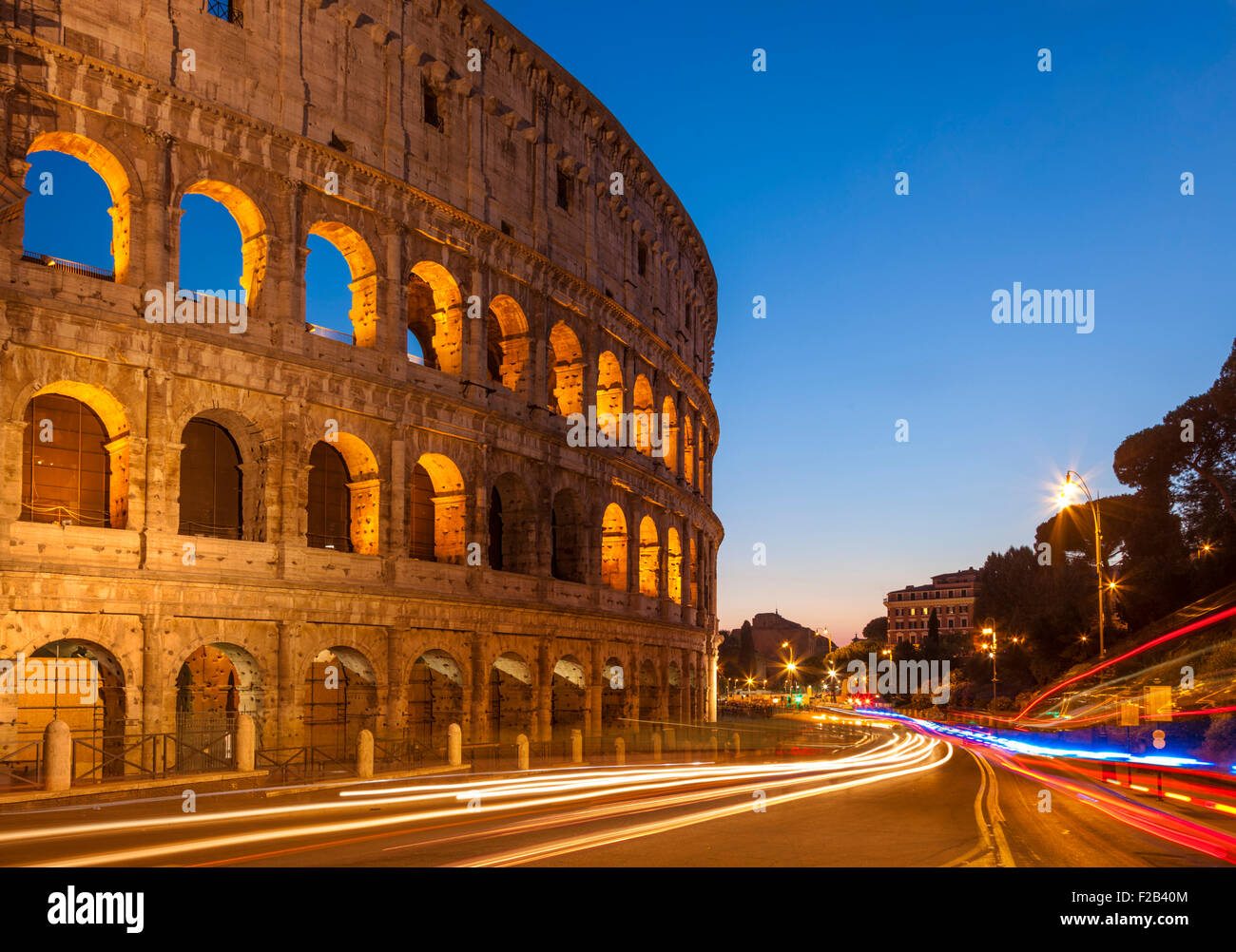 Rome Colosseum or Flavian Amphitheatre at night with light trails Rome Lazio Region Italy EU Europe Stock Photo