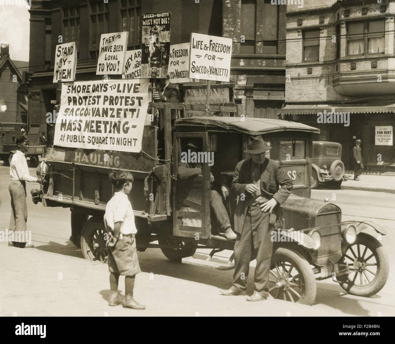 Truck with several protest signs five days prior to the executions of Sacco and Vanzetti. Signs read, '5 MORE DAYS TO LIVE, PROTEST PROTEST, SACCO & VANZETTI, MASS MEETING, At the public Square Tonight; Life & Freedom for Sacco & Vanzetti. August 1927. - (CSU 2015 5 110) Stock Photo