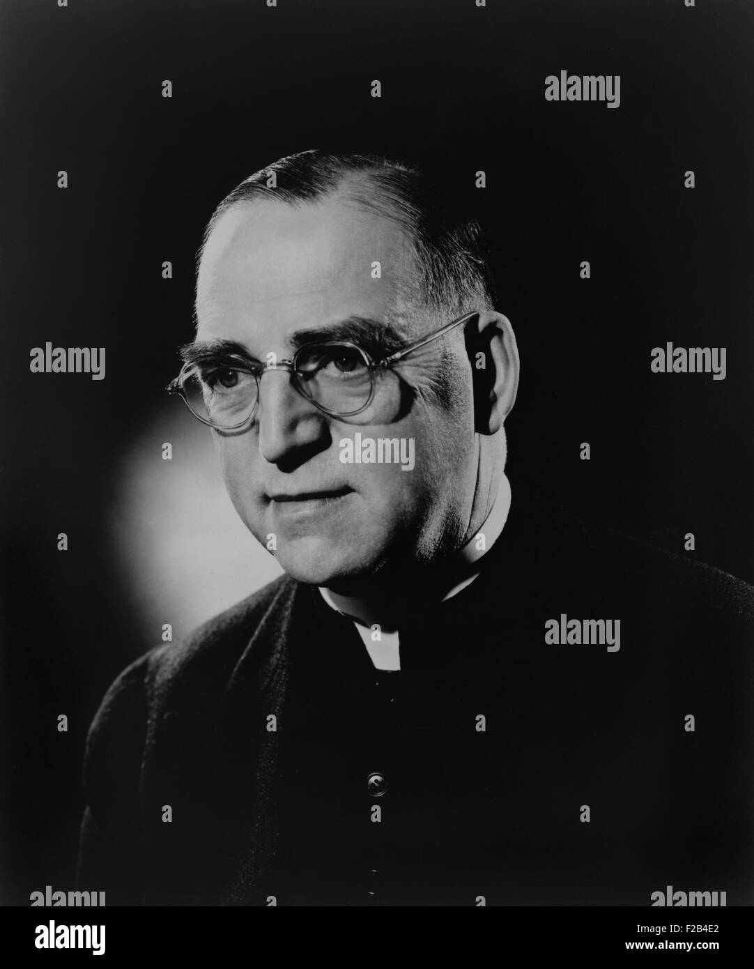 Father Edward J. Flanagan, founded 'Father Flanagan's Boys' Home' in 1917. It was an orphanage for boys between the ages of 10 and 16 where they received an education and learned a trade. Flanagan was portrayed by Spencer Tracey in the 1938 film, BOY'S TOWN, based on the life of Father Flanagan. Ca. 1938. - (BSLOC 2015 1 55) Stock Photo