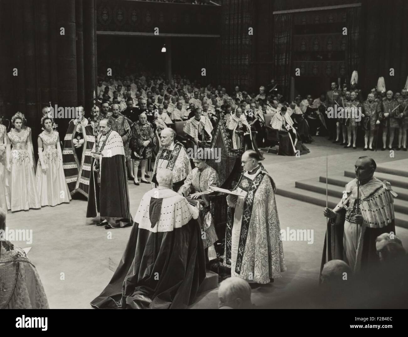 Coronation ceremony of Queen Elizabeth II, June 2, 1953. She is receiving the Spurs of Chivalry from the Lord Great Chamberlain. - (BSLOC 2015 1 46) Stock Photo