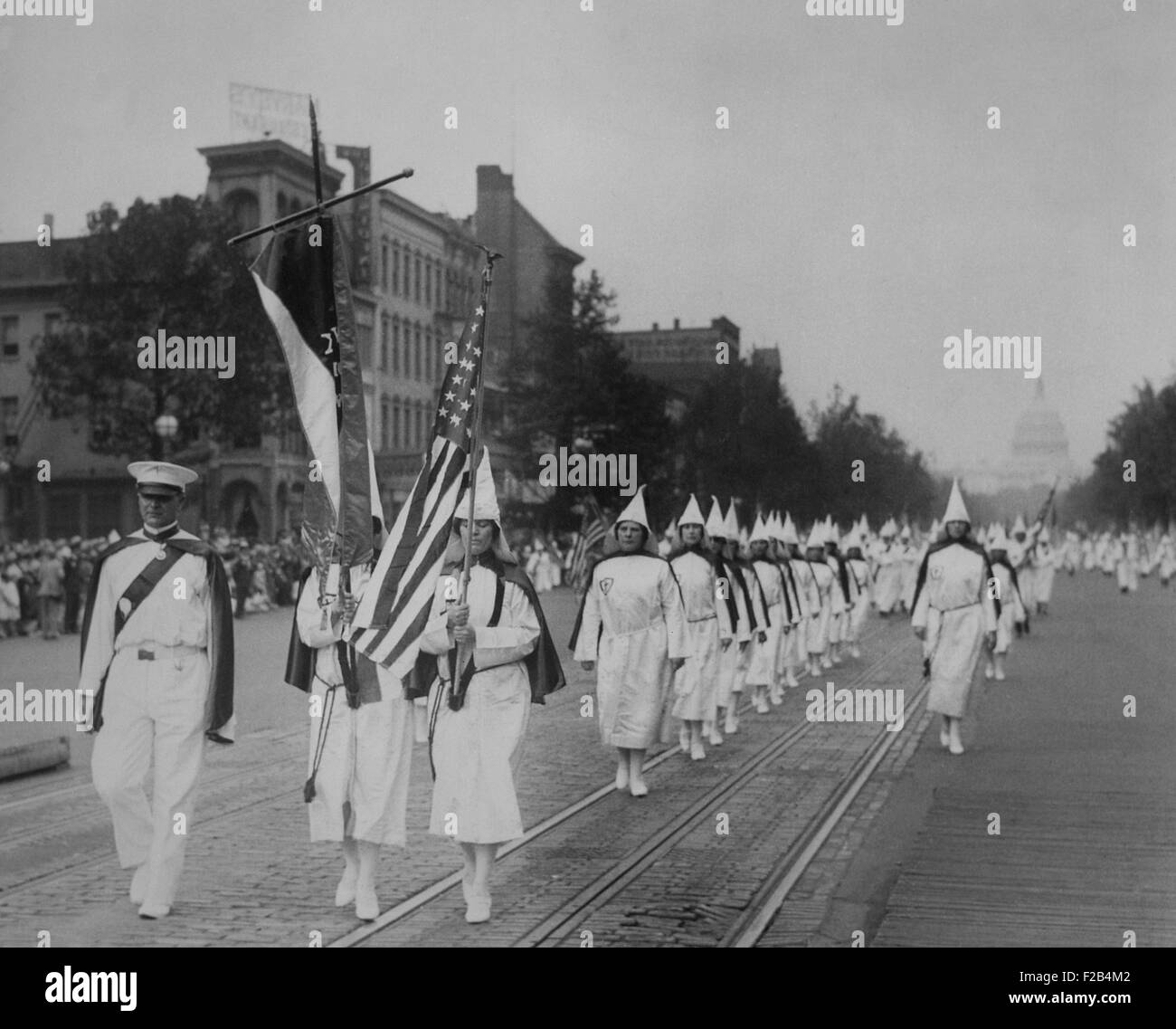 Women members lead a 1928 Ku Klux Klan parade on Pennsylvania Avenue. After D. W. Griffith's film 'Birth of A Nation', portrayed Klansmen as heroes, the KKK was revived and grew to an estimated membership between 6 to 3 million at its height in 1925. - (BSLOC 2015 1 205) Stock Photo