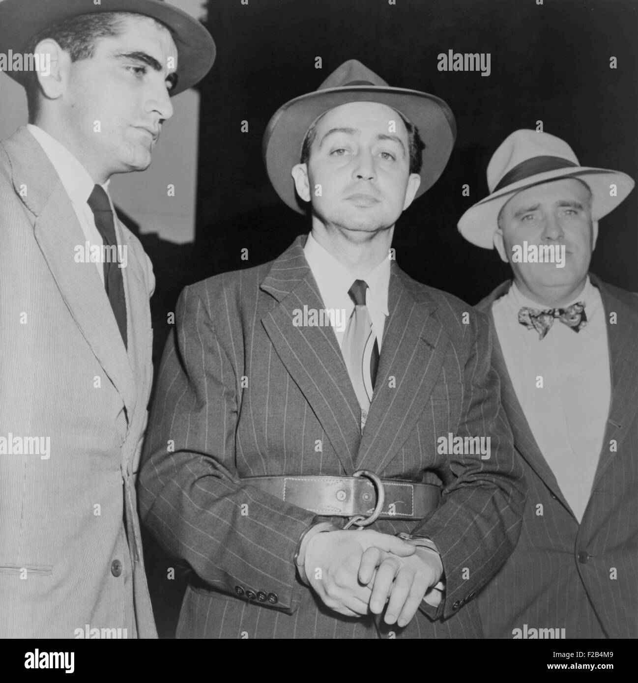 Harry Gold under arrest for spying in 1950. He confessed to espionage and helping Klaus Fuchs pass Manhattan Project secrets to Stock Photo