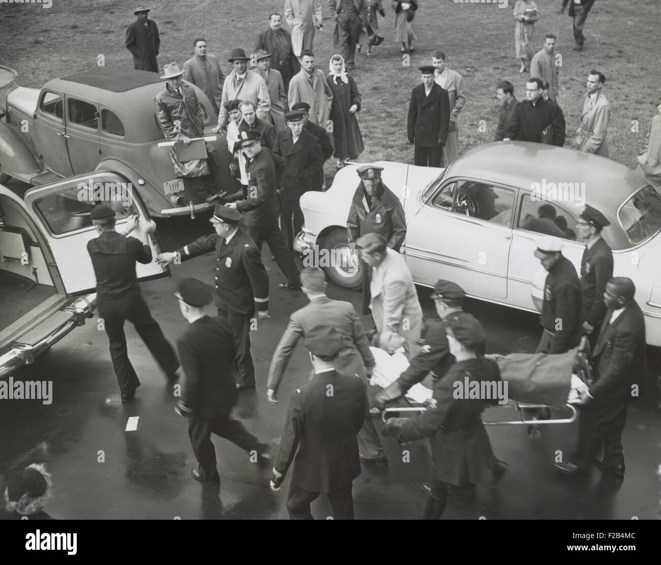 Rep. Clifford Davis, is carried from the Capitol after the shooting in the House chamber. Three Puerto Rican nationalists wounded five congressmen in the House of Representatives on March 1, 1954. - (BSLOC 2015 1 197) Stock Photo