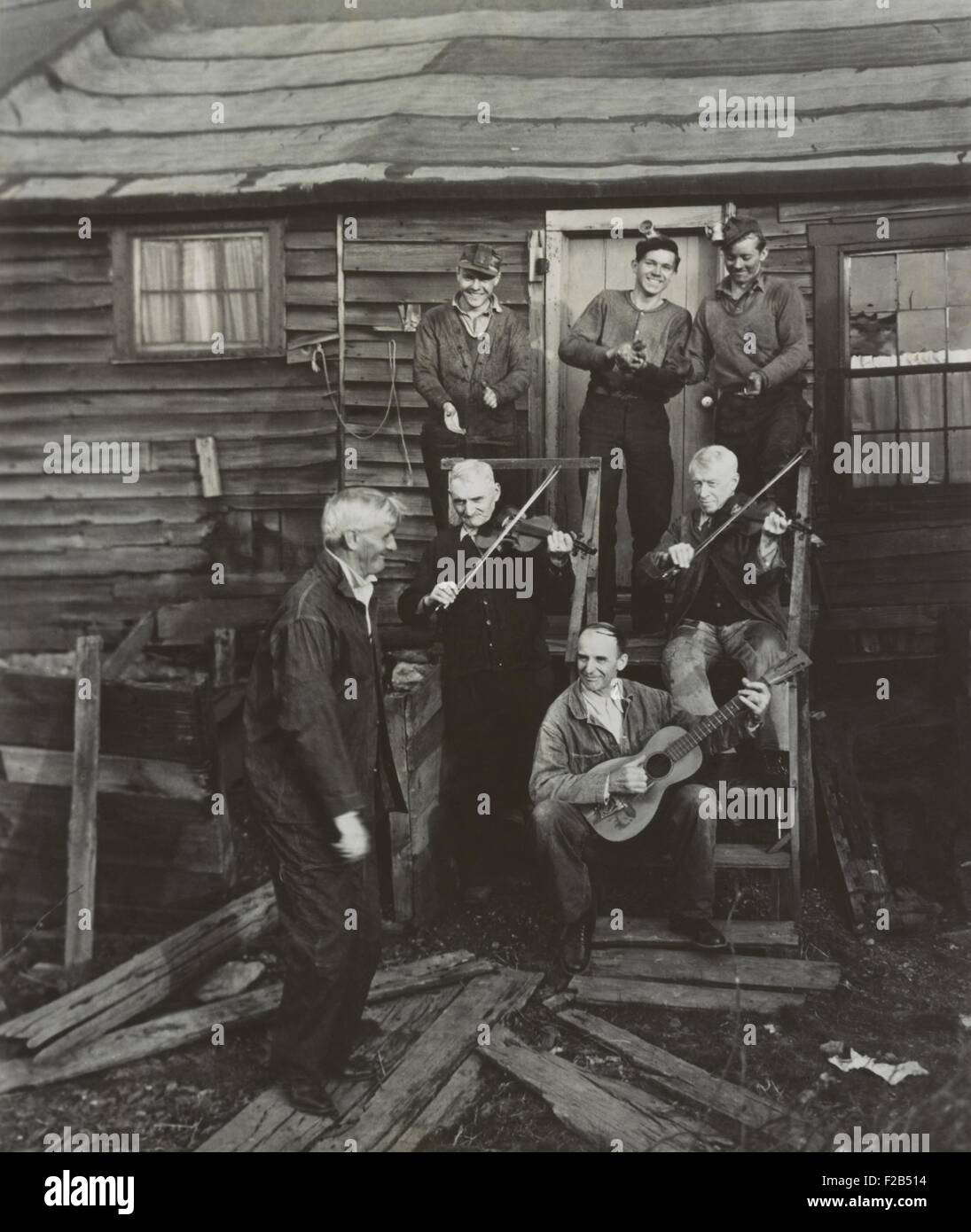 Staged hoedown in Pennsylvania with anthracite miners playing fiddles and a guitar. The session was recorded by folklorist George Korson. Ca. 1936-48. - (BSLOC_2015_1_160) Stock Photo