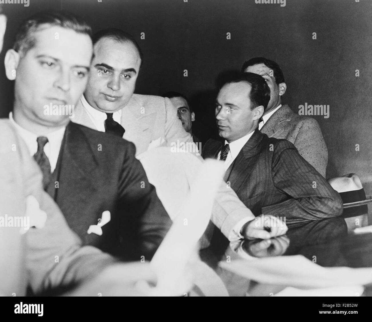Al Capone, at the time of his indictment for tax evasion, June 5, 1931. At right is one of Capone's attorneys, Michael Ahern. - Stock Photo