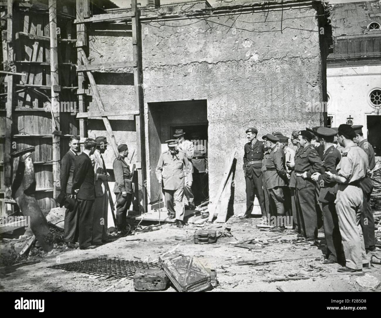 Premier Winston Church emerging from the Reich Chancellery, March 20, 1945. This was the underground Berlin bunker in which Hitler and Eva Braun committed suicide. - (BSLOC 2014 17 40) Stock Photo