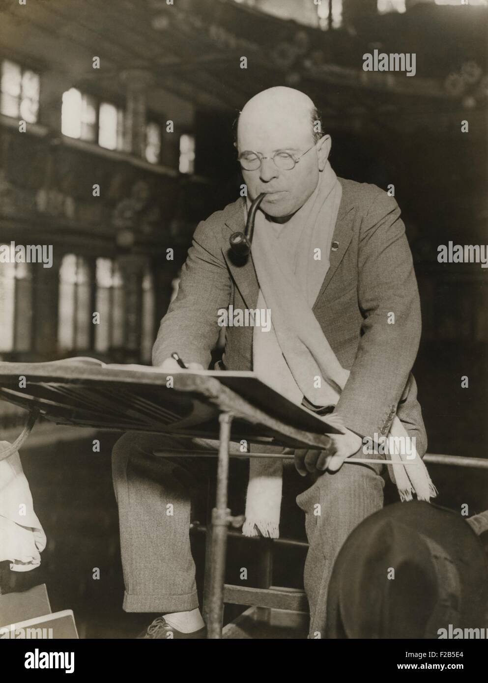 Pablo Casals at rehearsal conducting the Barcelona Philharmonic Orchestra. Casals generally appears at rehearsal in a scarf around his neck and a pipe between his lips. Ca. 1930-38. - (BSLOC 2014 17 200) Stock Photo
