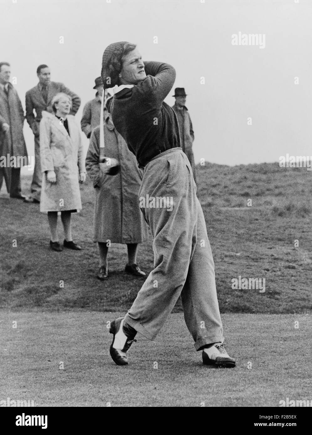 Babe Didrikson, watching golf ball as she completes her swing. The multisport athlete was playing at the Ladies Amateur Championship, Gullane, Scotland, 1947. - (BSLOC 2014 17 182) Stock Photo