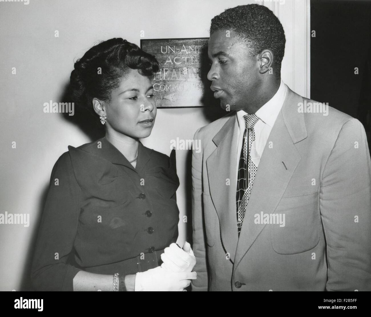 Jackie Robinson, Brooklyn baseball player and his wife outside the HUAC committee room. July 18, 1949. While he was considered a 'friendly' witness, his testimony to the House Un-American Activities included criticism of American racial violence and segregation. - (BSLOC 2014 17 167) Stock Photo