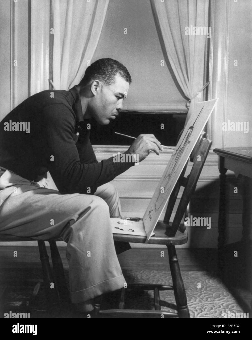 Boxer Joe Louis painting a picture for Urban League Guild Exhibit, Sept. 1949 - (BSLOC 2014 17 154) Stock Photo