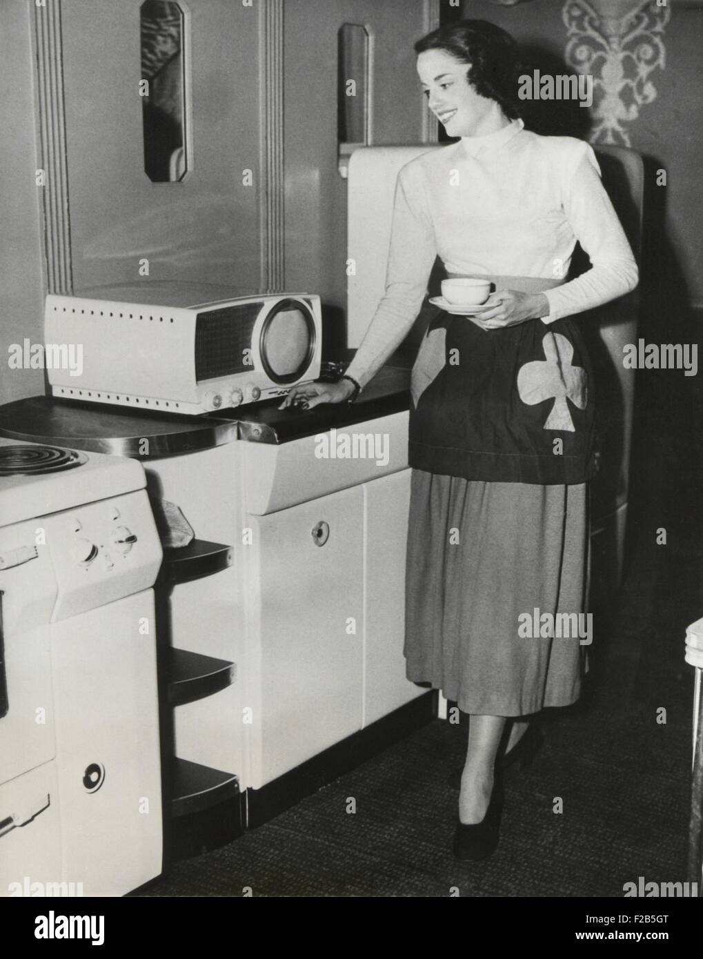 A television in the kitchen for the first broadcast of a cooking show in New York. Sept. 1949. - (BSLOC 2014 17 135) Stock Photo