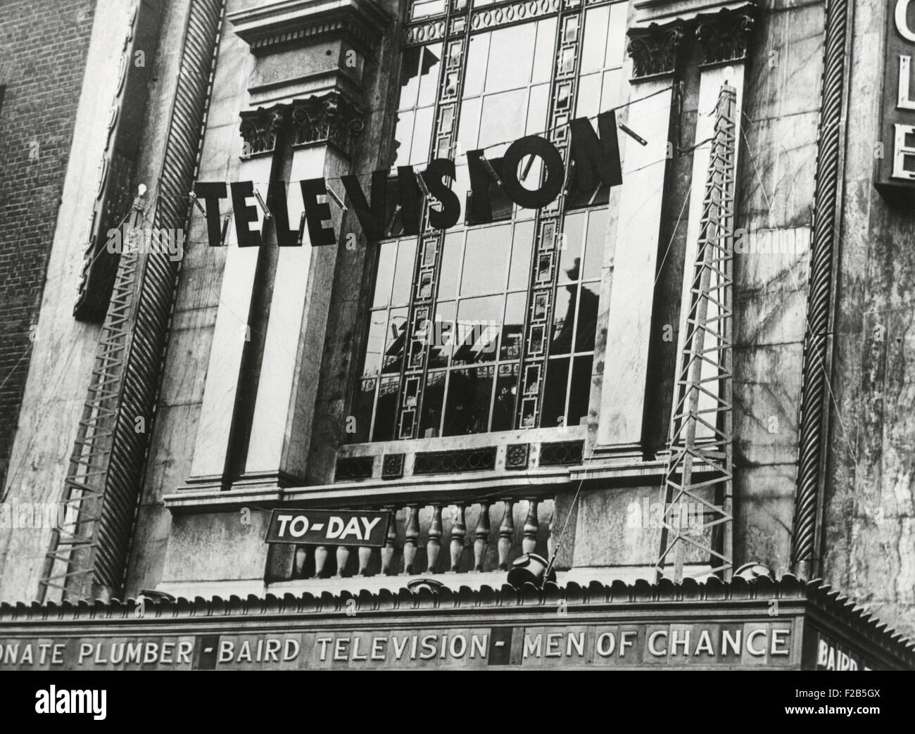 Television was shown for the first time in England, June 1932. The demonstration showed the Epson Derby at the Metropole Cinema. On the theater's marque is 'Baird Television' referring the British television pioneer, John Logie Baird. - (BSLOC 2014 17 133) Stock Photo