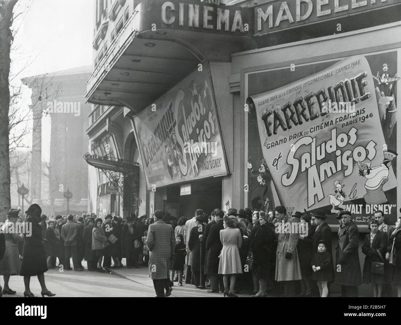 Parisiennes at a movie theater showing the Disney film, 'Saludos Amigos' in April 1947. At the Madeleine Cinema, Boulevard des Capucines, Paris. - (BSLOC 2014 17 126) Stock Photo