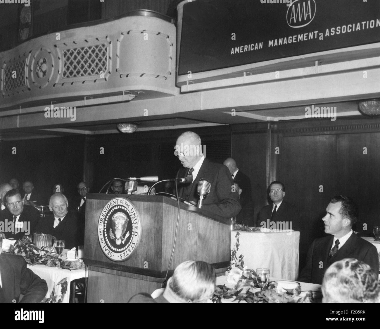 President Eisenhower speaking at American Management Association dinner. Vice President Richard Nixon is at right. Also attending was visiting World War 2 British Field Marshall Montgomery (second from left). New York City, May 20, 1958. - (BSLOC 2014 16 75) Stock Photo