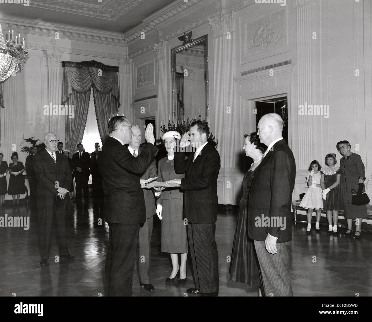 Sen. William Knowland administers the Oath of Office to Vice President-elect Richard Nixon. The private swearing in ceremony took place in the East Room of the White House on Sunday, Jan. 20, 1957. At far right is Hannah Nixon with her granddaughters, Julie and Tricia. - (BSLOC 2014 16 33) Stock Photo