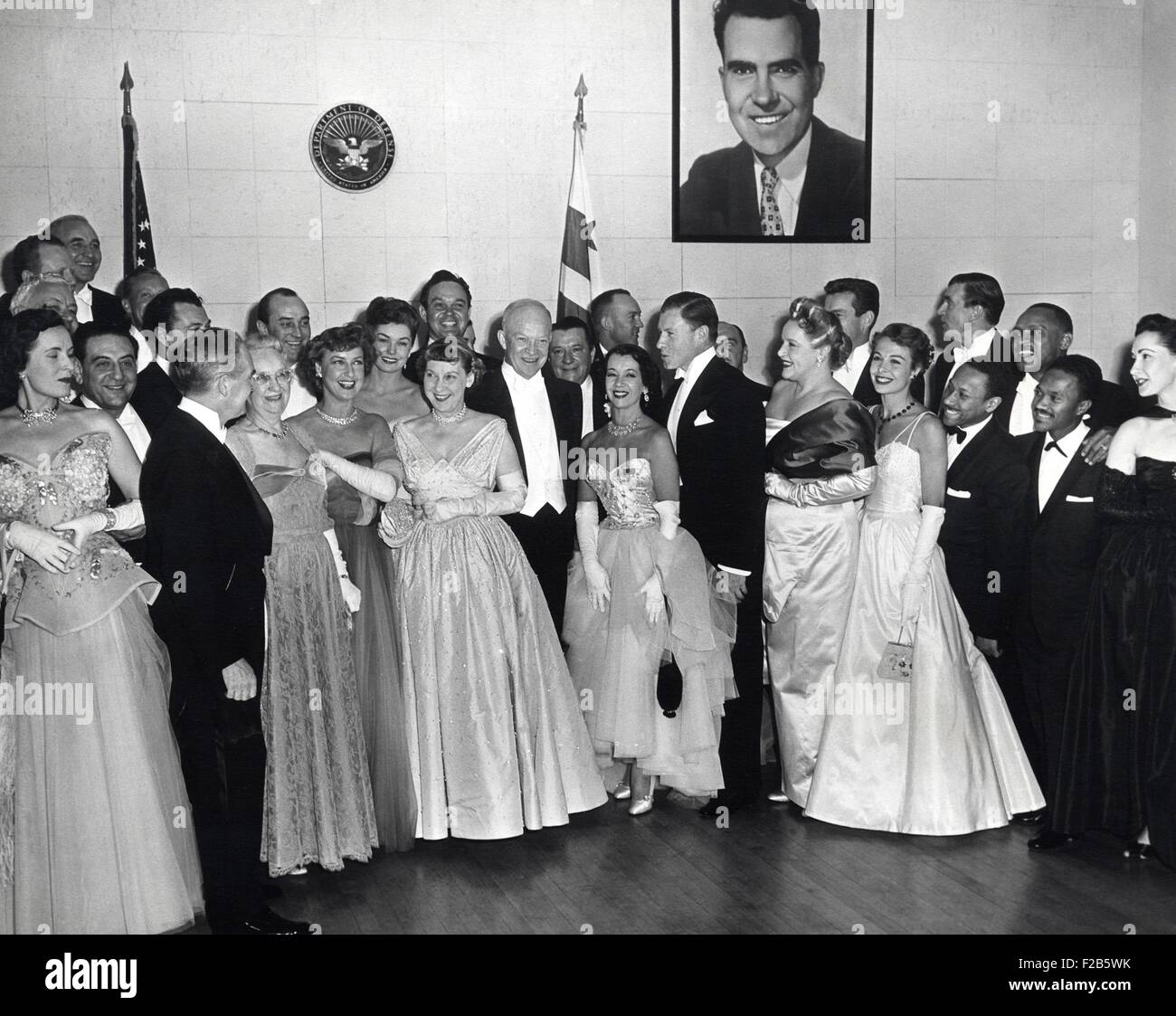 President Dwight and First Lady Mamie Eisenhower with guests attending the Inaugural Ball. Jan. 20, 1953. L-R: Guy Lombardo (standing behind an unidentified woman), Fred Waring (facing Mrs. Doud), Mrs. Elvira Doud, Jeanette MacDonald, Mamie Eisenhower, the President, Lily Pons, and George Murphy - (BSLOC 2014 16 29) Stock Photo